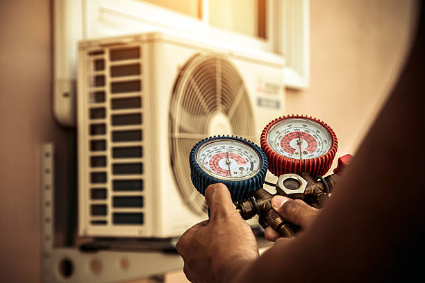 Professional Air Conditioning Service technician working in Sherwood, OR